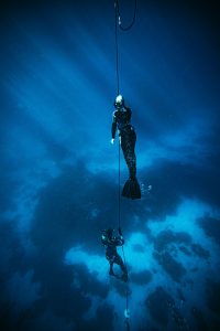 Two people free-diving